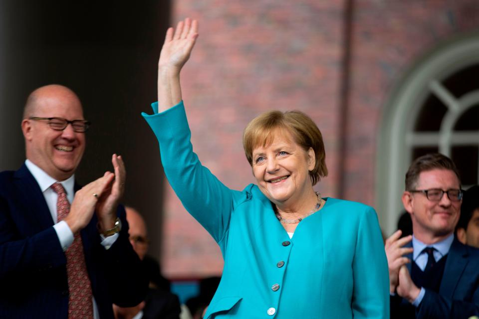 German Chancellor Angela Merkel waves before delivering the keynote speech at Harvard's 368th commencement ceremony at Harvard University in Cambridge, Massachusetts, on May 30, 2019. (Photo by Allison Dinner / AFP)ALLISON