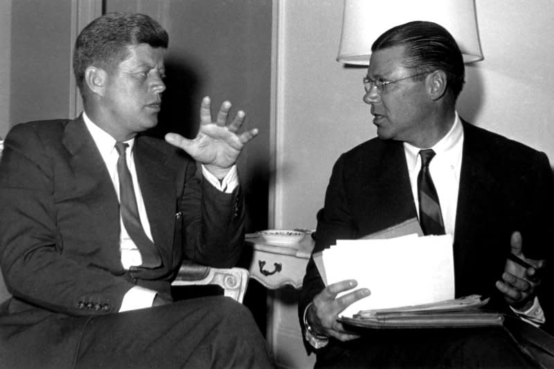 President John F. Kennedy and Defense Secretary Robert McNamara meet in January 4, 1961. On November 18, 1961, weary of ordering a full-scale deployment of troops, Kennedy sends 18,000 military advisers to South Vietnam.
