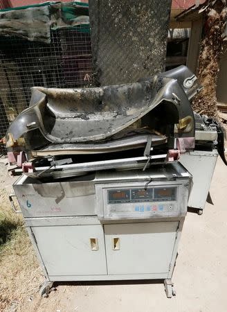 Burnt incubators stand outside a maternity ward after a fire broke out at Yarmouk hospital in Baghdad, Iraq, August 10, 2016. REUTERS/Thaier Al-Sudani
