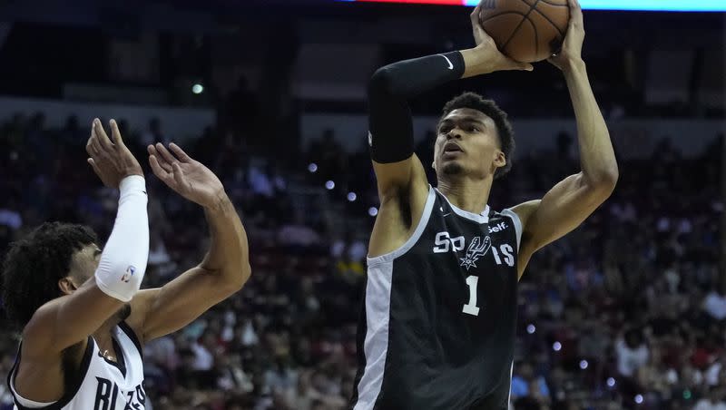 San Antonio Spurs’ Victor Wembanyama shoots over Portland Trail Blazers’ Justin Minaya during an NBA summer league game on July 9, 2023, in Las Vegas.