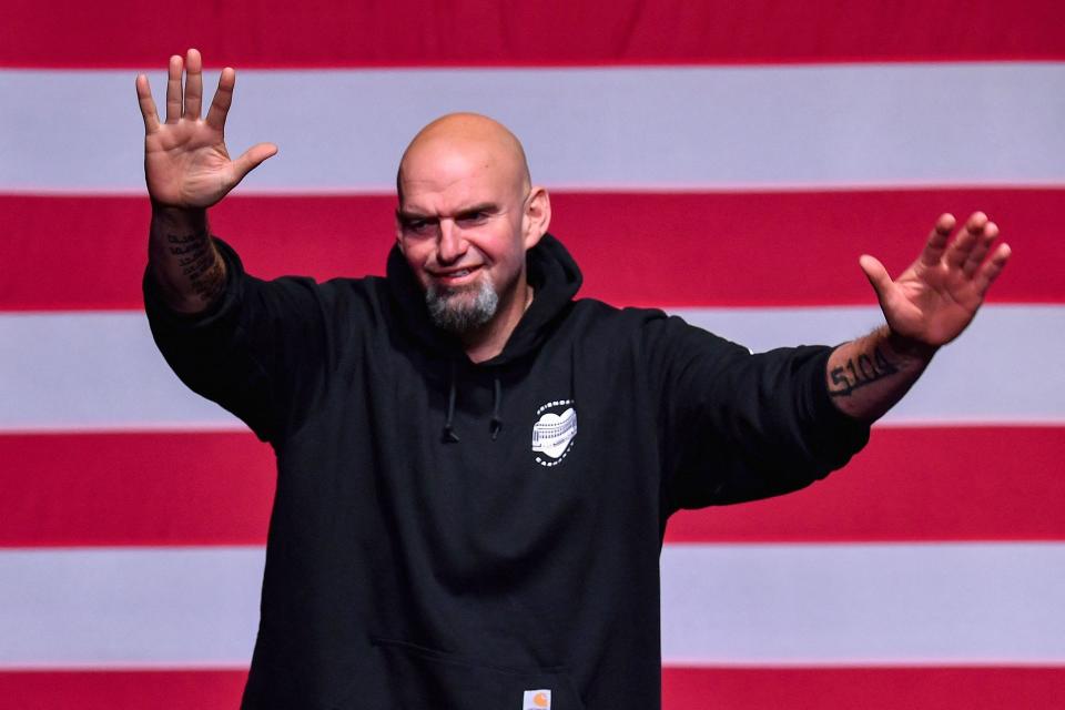 Pennsylvania Democratic Senatorial candidate John Fetterman waves onstage at a watch party during the midterm elections at Stage AE in Pittsburgh, Pennsylvania, on Nov. 8, 2022. President Joe Biden's party picked up a seat in the upper chamber of Congress Tuesday as Fetterman defeated celebrity doctor Mehmet Oz in Pennsylvania, media projections showed.