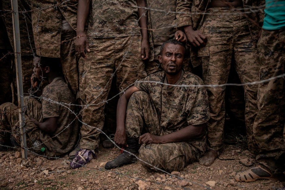 Ethiopian National Defense Forces soldiers are held at a remote mountain detention camp for an estimated 3,000 prisoners of war south of Mekelle on June 23, after being captured during fighting the previous week by Tigray Defense Force rebels.<span class="copyright">Finbarr O'Reilly</span>