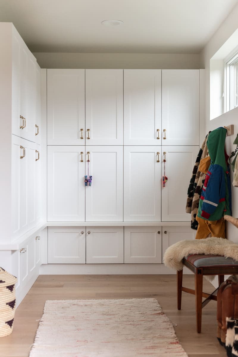 Storage cabinets in entry of mountain home.