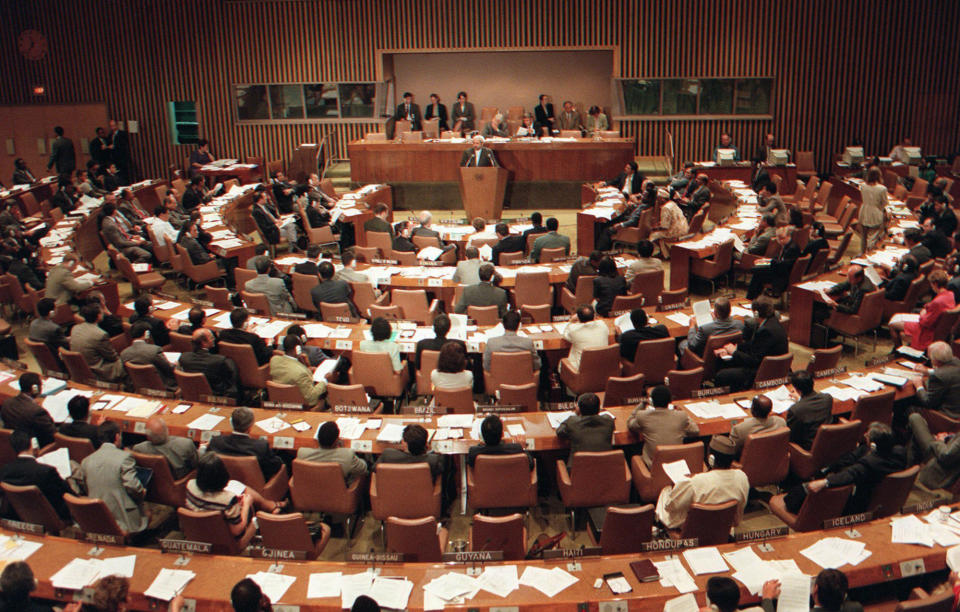 FILE - In this Tuesday, Sept. 10, 1996, file photo, the United Nations General Assembly meets for discussions on the Nuclear Test Ban Treaty at U.N. headquarters. The year 2021 marks the 25th anniversary of the signing of the Comprehensive Nuclear Test Ban Treaty, which has yet to enter into force for lack of ratification by eight crucial nations but has helped reduce such tests. And it's the 75th anniversary of the General Assembly's very first resolution, which sought proposals to eliminate atomic weapons. (AP Photo/Osamu Honda, File)