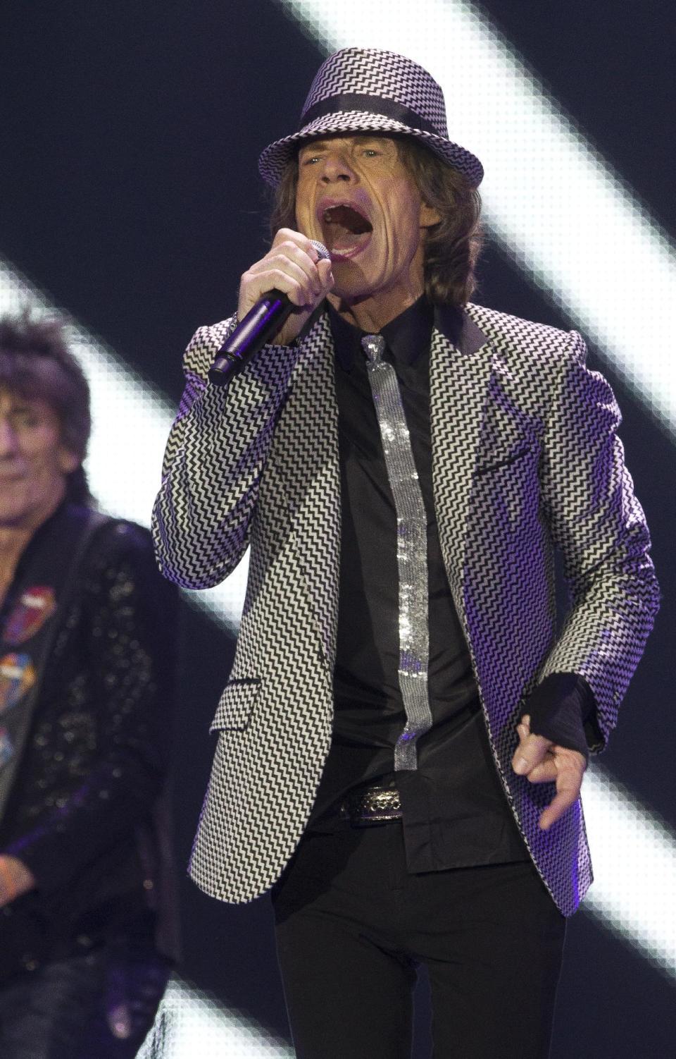 Mick Jagger of The Rolling Stones performs at the O2 arena in east London, Sunday, Nov. 25, 2012. The band are playing four gigs to celebrate their 50th anniversary, including two shows at London’s O2 and two more in New York. (Photo by Joel Ryan/Invision/AP)