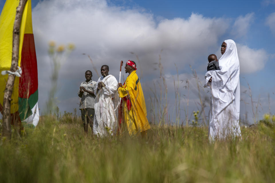 Apostolic Pentecostals celebrate Easter in field in the Johannesburg township of Soweto Sunday April 4, 2021. Such South African independent church consist of small groups of worshippers mixing African traditions and bible study. (AP Photo/Jerome Delay)