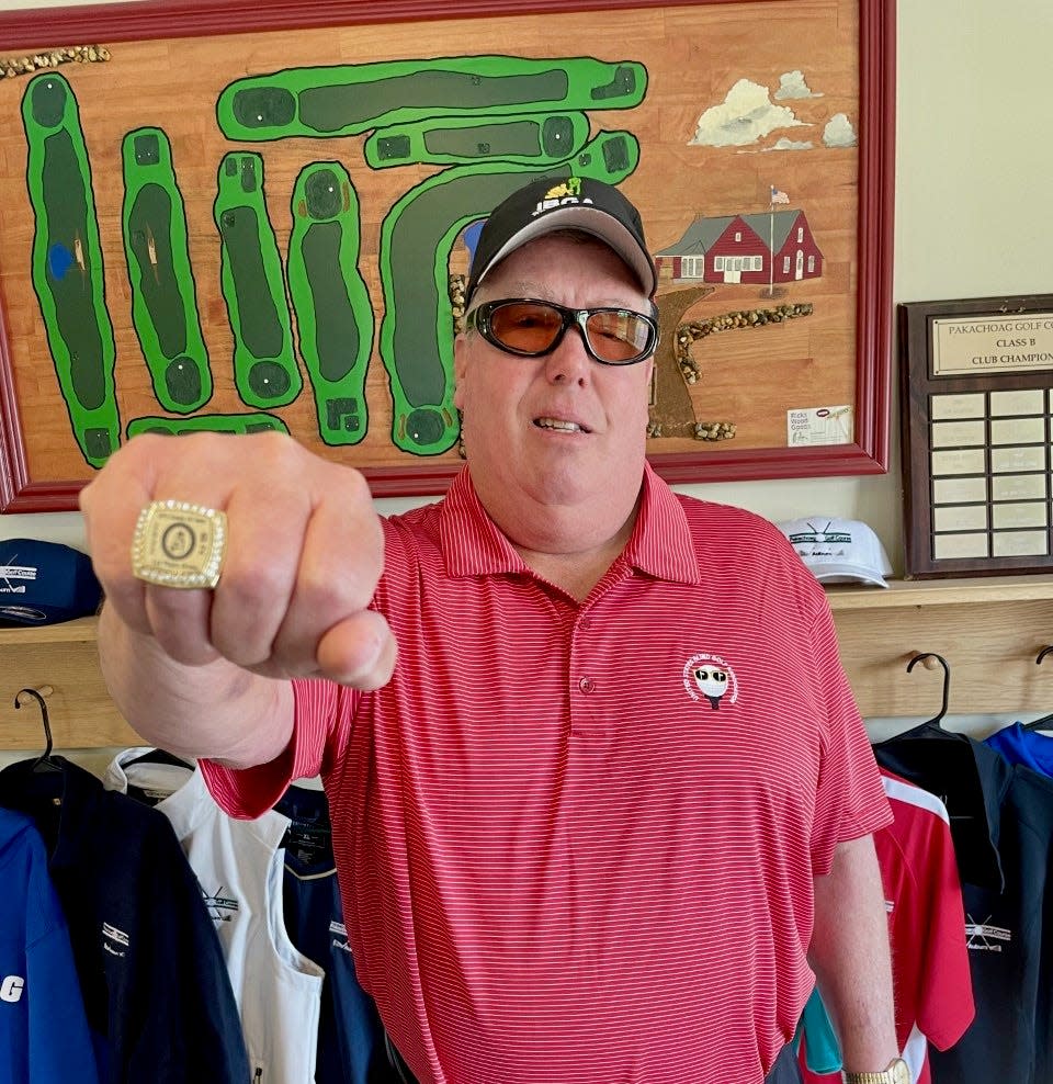 At Pakachoag Golf Course, Jim Whitton shows the gold ring he won at U.S. Open Blind Golf Championship.