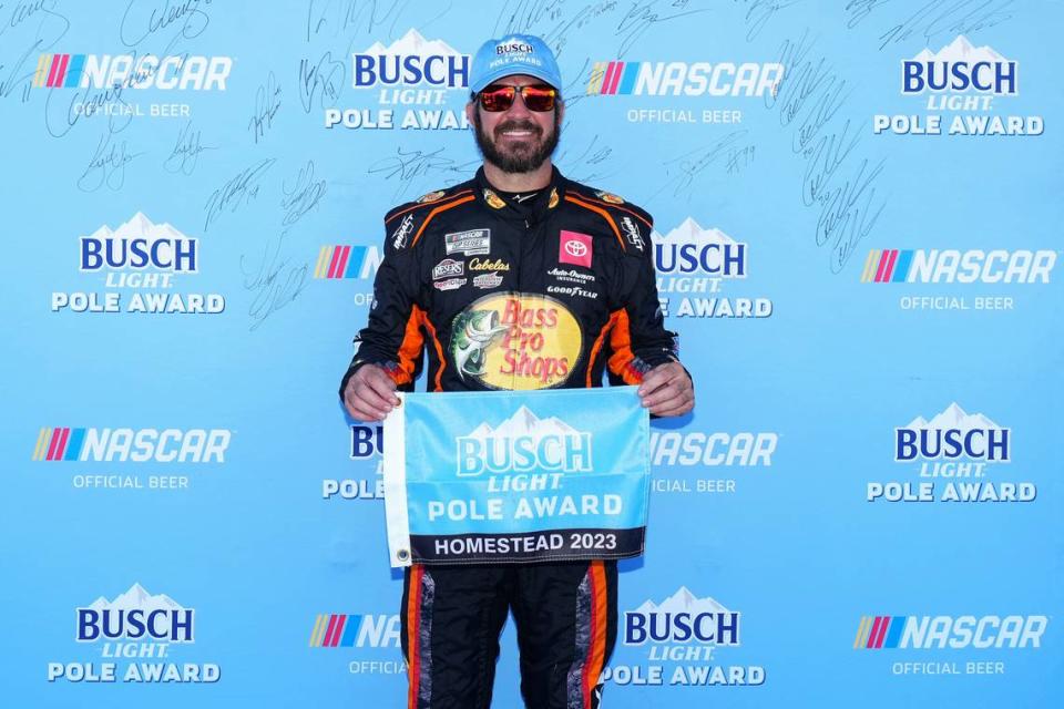 Oct 21, 2023; Homestead, Florida, USA; NASCAR Cup Series driver Martin Truex Jr (19) celebrates after winning the pole for the 4EVER 400 presented by Mobil 1 at Homestead-Miami Speedway.