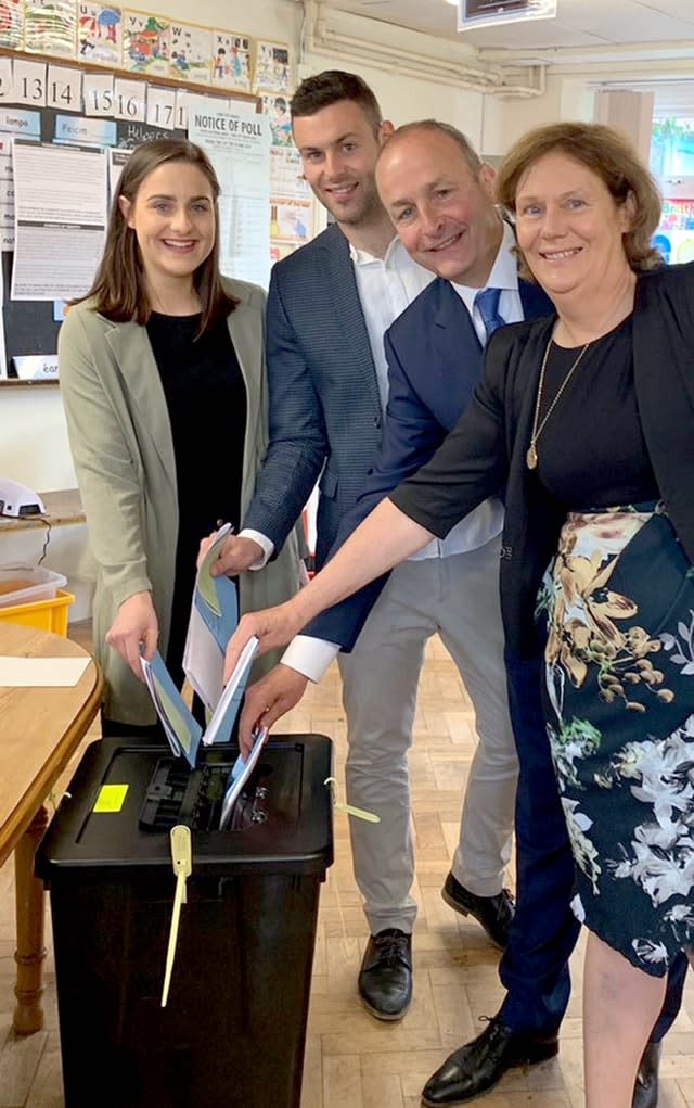 Fianna Fail leader Micheal Martin, voting with his wife Mary and their children Micheal A and Aoibhe