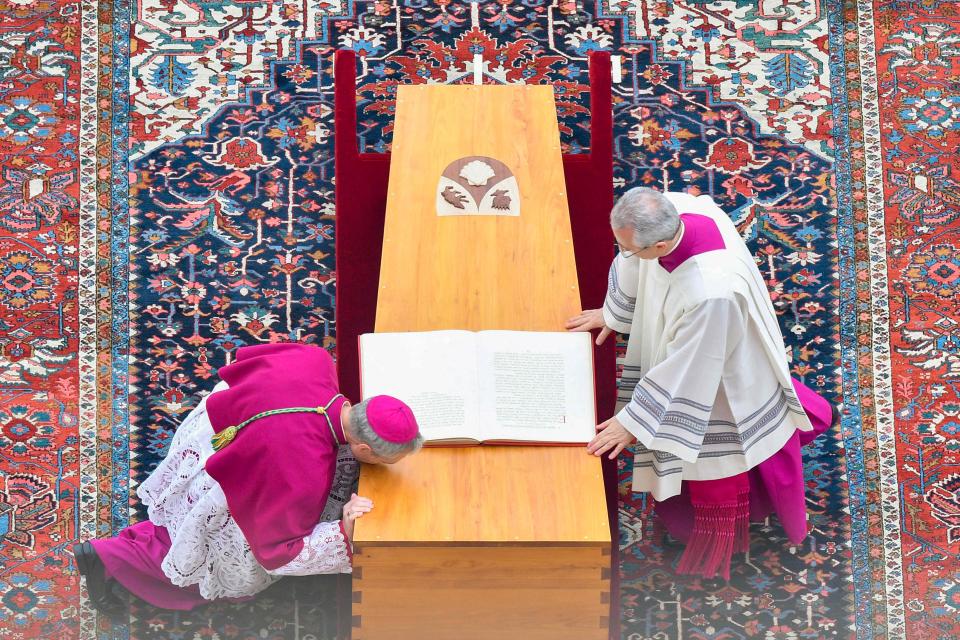 January 5, 2022: German Archbishop Georg Gaenswein kisses the coffin of Pope Emeritus Benedict XVI at the start of his funeral mass at St. Peter's square in the Vatican on Jan. 5, 2023.