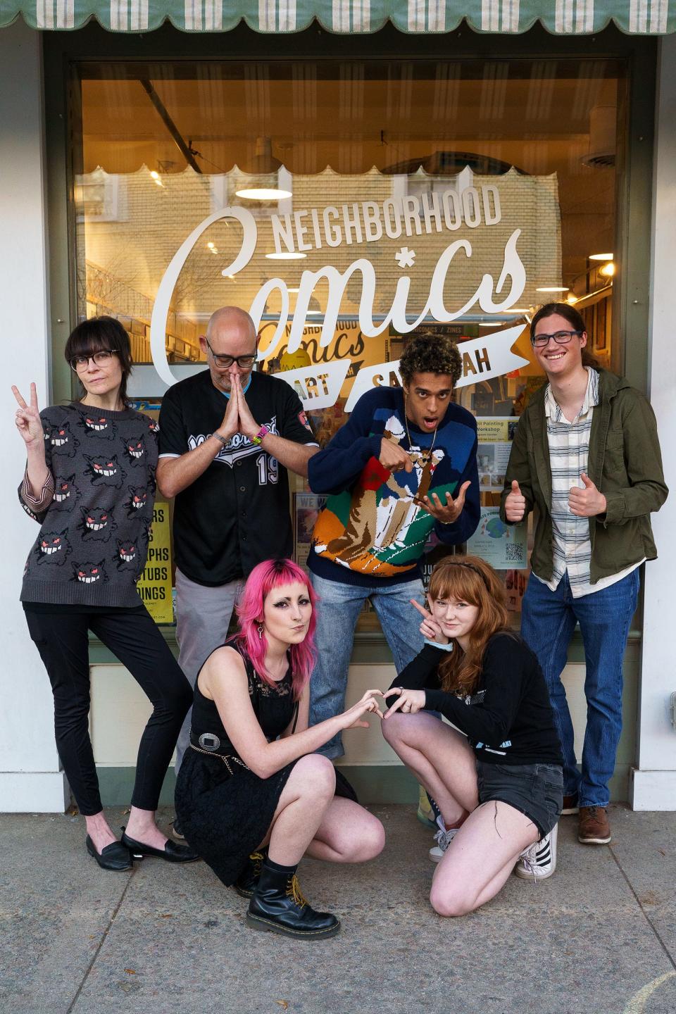 The Staff of Neighborhood Comics pictured outside of the Bull Street location.