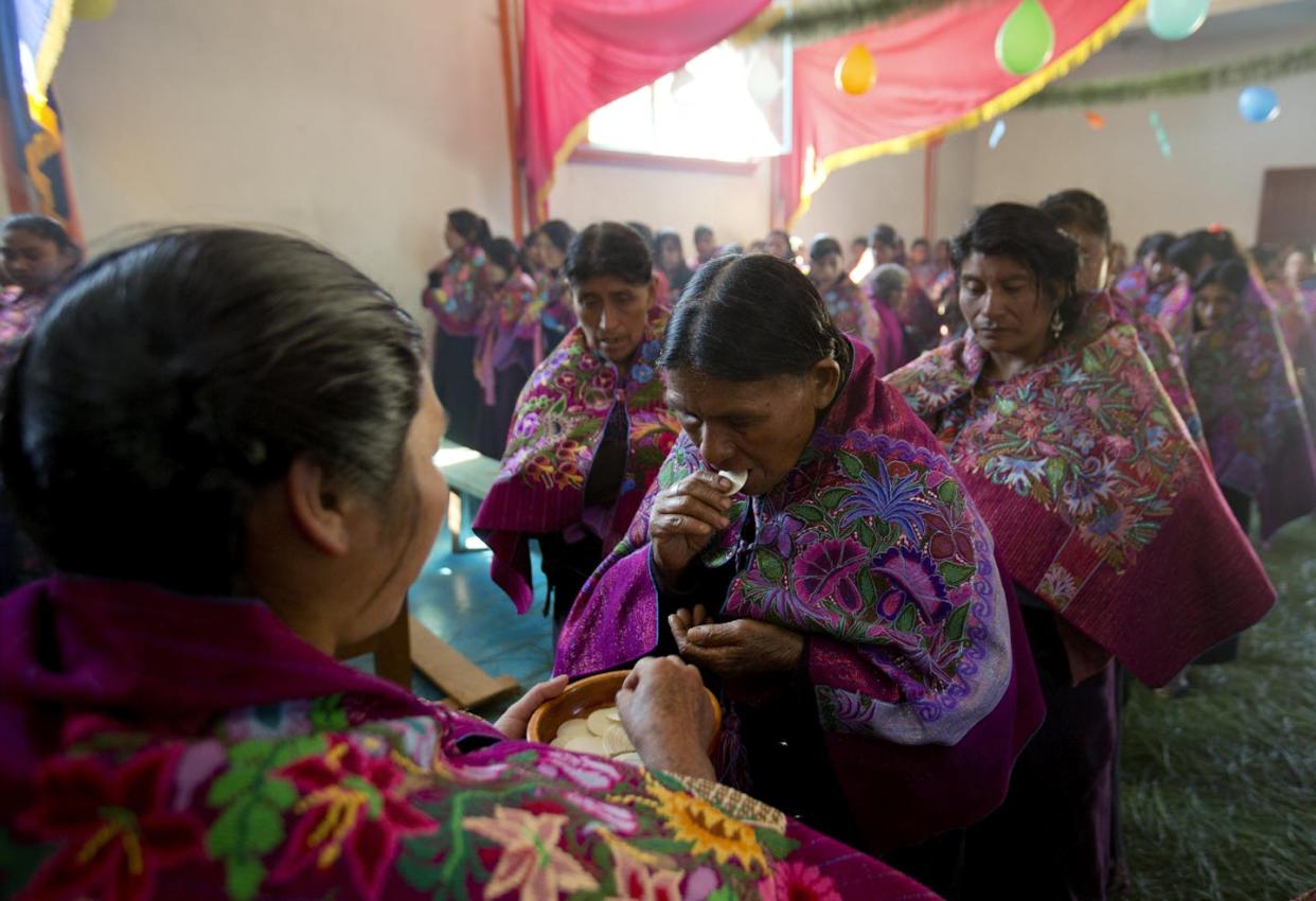 Tzotzil women line up for Holy Communion during a Catholic Mass in Chiapas state, Mexico, in 2016. <a href="https://newsroom.ap.org/detail/APTOPIXMexicoPopeIndigenous/0e5d46785792469db2511651be315c40/photo?Query=609821321857&mediaType=photo&sortBy=arrivaldatetime:asc&dateRange=Anytime&totalCount=1&currentItemNo=0" rel="nofollow noopener" target="_blank" data-ylk="slk:AP Photo/Eduardo Verdugo;elm:context_link;itc:0;sec:content-canvas" class="link ">AP Photo/Eduardo Verdugo</a>