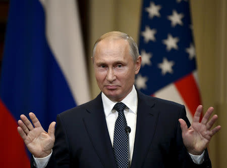 FILE PHOTO: Russia's President Vladimir Putin gestures during the joint press conference with U.S. President Donald Trump in the Presidential Palace in Helsinki, Finland July 16, 2018. Lehtikuva/Jussi Nukari via REUTERS/File Photo