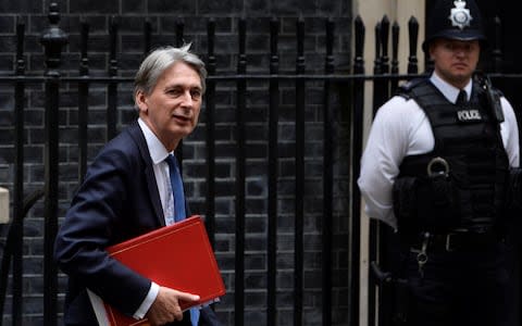  Philip Hammond leaves 10 Downing Street - Credit: Reuters