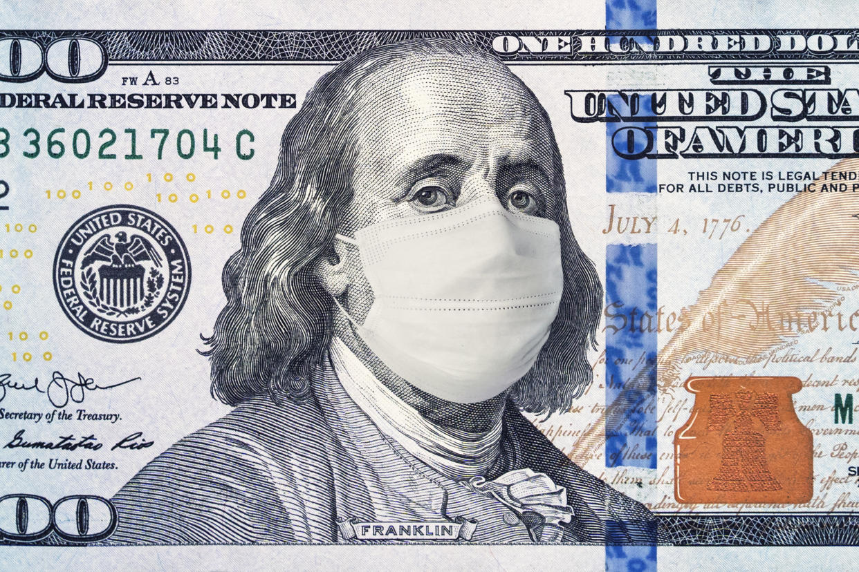 American President with a face mask against CoV infection. 100 dollar banknote. Coronavirus in United States. Concept quarantine and recession. Global economy hit by corona virus outbreak and pandemic