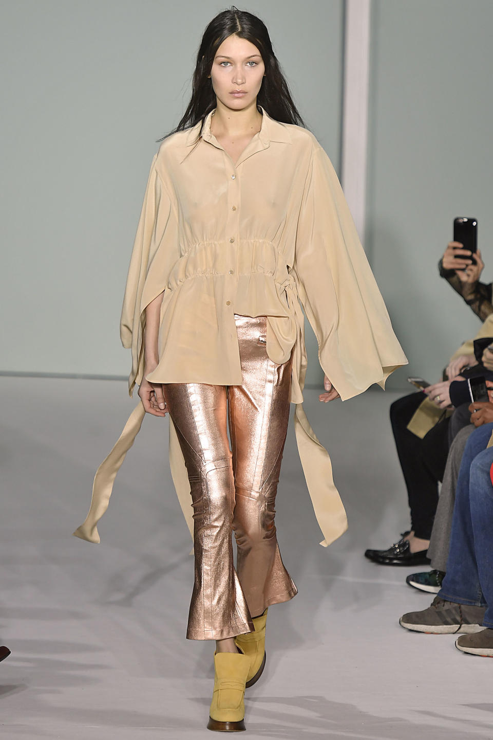 <p>Bella wore rose-gold trousers and a cream shirt for Sies Marjan<span> AW17's runway collection at NYFW</span></p>