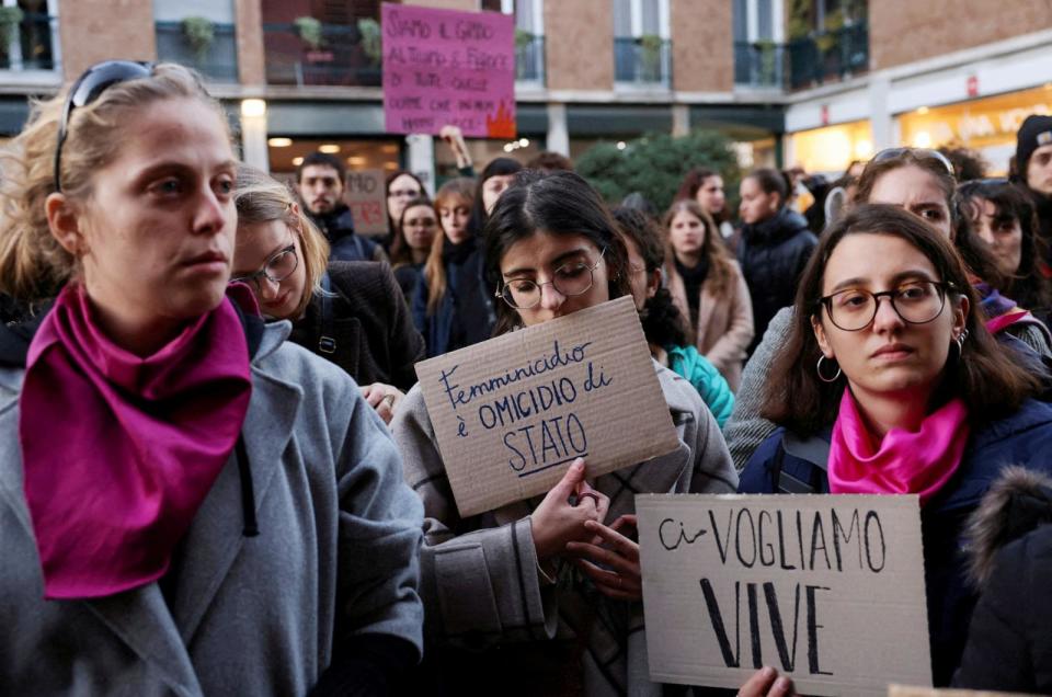 PHOTO: Students hold banners reading 'Femincide is a state murder' and 'We want us alive' as they perform a flash mob to protest against feminicide and violence against women, following 22-years-old Giulia Cecchettin's murder, Milan, Italy, Nov. 22, 2023. (Claudia Greco/Reuters)