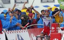 Katusha rider Joaquim Rodriguez of Spain celebrates as he crosses the finish line to win the 195-km (121.16 miles) 12th stage of the 102nd Tour de France cycling race from Lannemezan to Plateau de Beille in the French Pyrenees mountains, France, July 16, 2015. REUTERS/Eric Gaillard