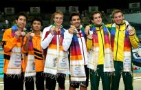 DELHI, INDIA - OCTOBER 12: (L to R) Ken Nee Yeoh and Bryan Lomas (bronze) of Malaysia, Reuben Ross and Alexandre Despatie (gold) of Canada and Ethan Warren and Matthew Mitcham (silver) of Australia pose with the medals won in the Men's 3m Synchro Springboard Final at Dr. S.P. Mukherjee Aquatics Complex on day nine of the Delhi 2010 Commonwealth Games on October 12, 2010 in Delhi, India. (Photo by Cameron Spencer/Getty Images)