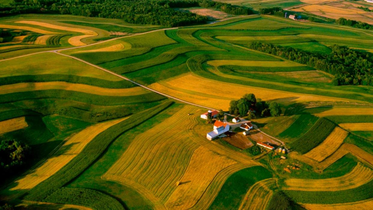 PHOTO: This undated photo shows an aerial view of a farmstead surrounded by contour strips of alfalfa, corn and oats in Wisconsin. (Richard Hamilton Smith/Design Pics Editorial/Getty Images)