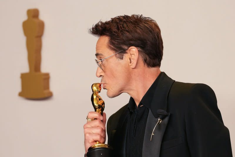 Robert Downey Jr., of "Oppenheimer," celebrates his Best Actor in a Supporting Role Oscar backstage at the Academy Awards in Los Angeles on Sunday. Photo by Pat Benic/UPI