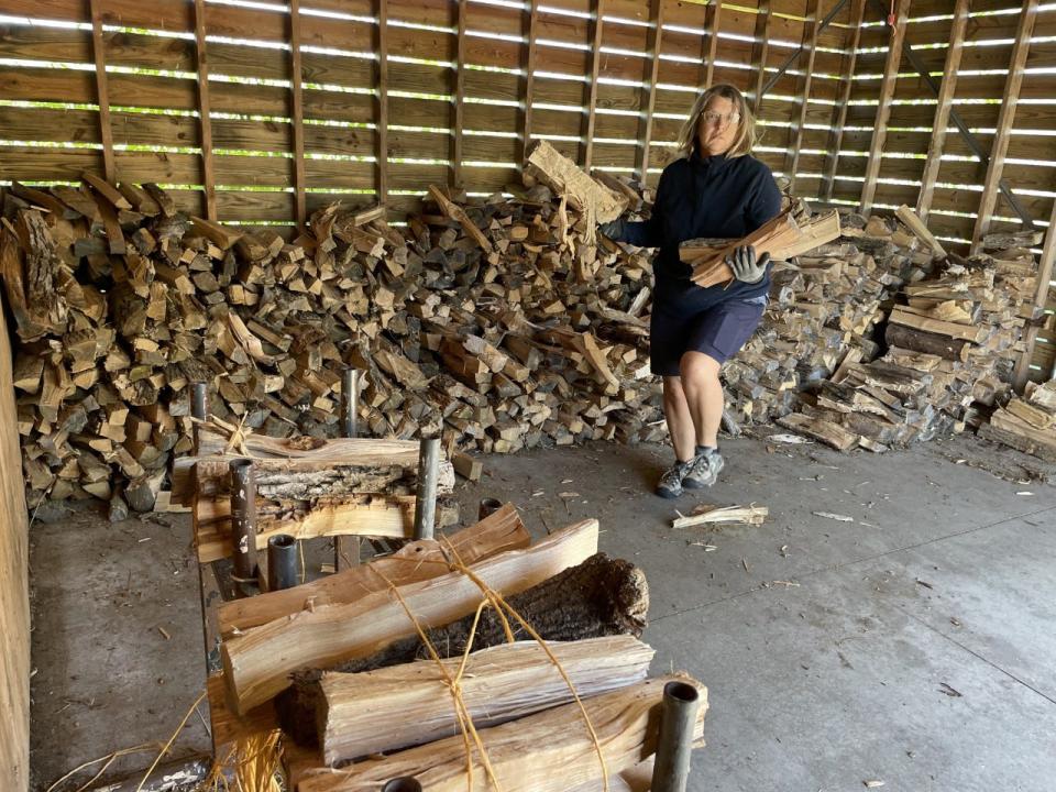 Nancy Gilliom bundles firewood at Harrington Beach State Park where she was volunteering as a camp host. 