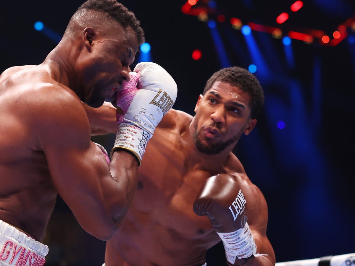 Anthony Joshua sends message to Tyson Fury with apparent gun gesture ...