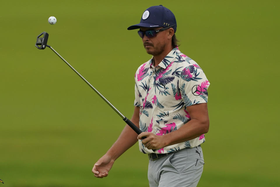 Rickie Fowler walks off the13th green during a practice round for the PGA Championship golf tournament, Tuesday, May 17, 2022, in Tulsa, Okla. (AP Photo/Matt York)