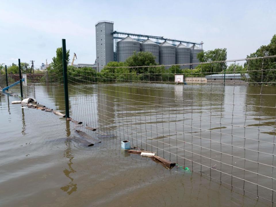 This general view shows grain silos encroached by floodwaters in Kherson on June 8, 2023, as water levels rose in the city following damage sustained at the Kakhovka hydroelectric power plant dam. (Photo by Aleksey Filippov/AFP via Getty Images)