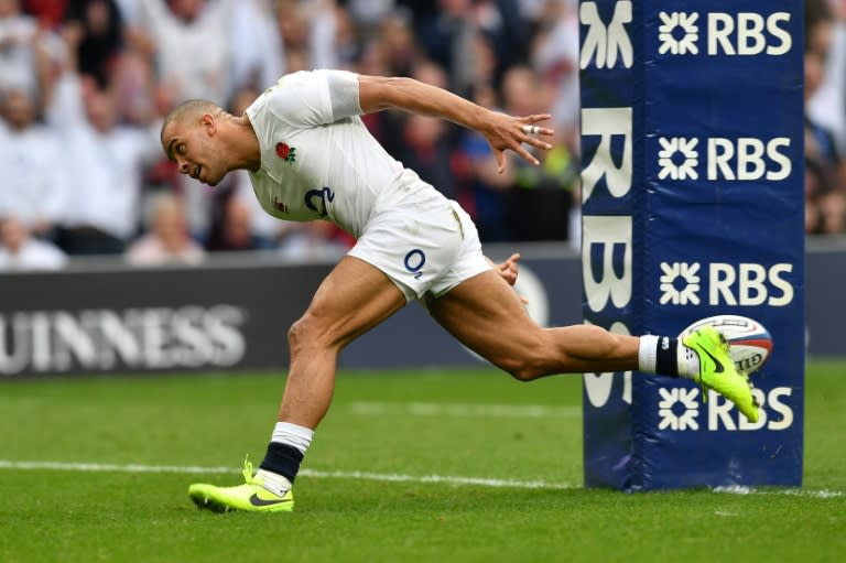 England's centre Jonathan Joseph scores a try during their Six Nations rugby union match against Scotland, at Twickenham stadium in south-west London, on March 11, 2017