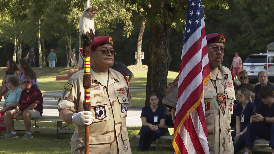 William Wind, U.S. Navy (retd) and Curtis Smith, U.S. Marine Corps (retd) help open ceremonies held at the Ocmulgee National Historical Park on Saturday, Sept. 17, 2022, in Macon, Ga. Wind and Smith are members of the Muscogee (Creek) Nation Honor Guard. (AP Photo/Sharon Johnson)