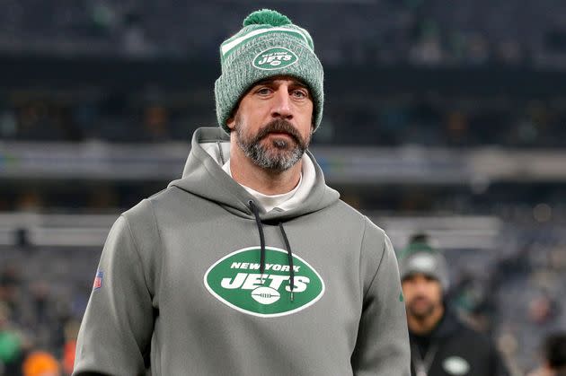 New York Jets quarterback Aaron Rodgers leaves the field after a Dec. 24 game against the Washington Commanders in East Rutherford, New Jersey.