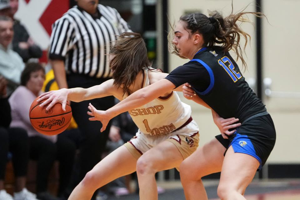 Olentangy's Whitney Stafford (12) defends Watterson's Sophie Ziel (1) during Tuesday night's regional semifinal.