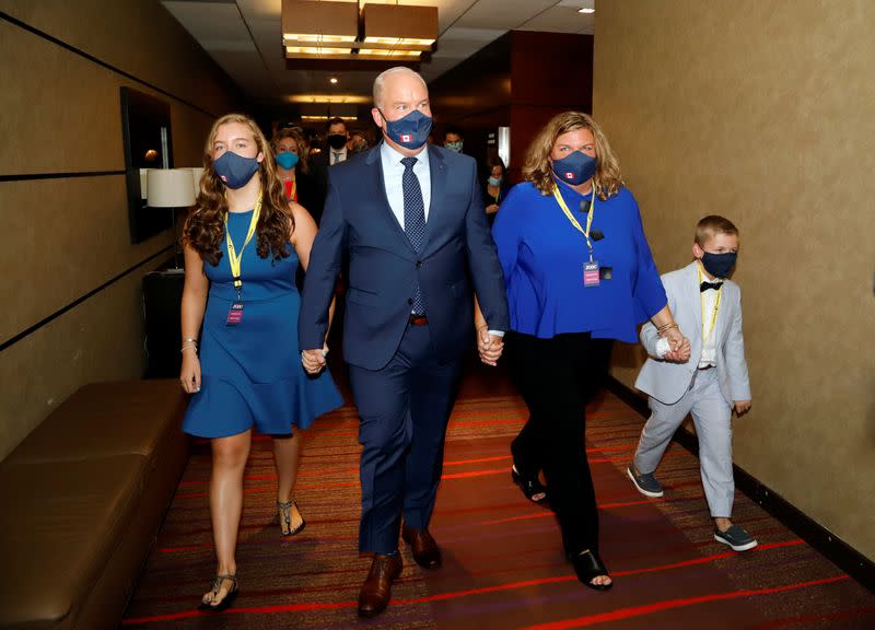 Erin O'Toole walks with his family, wife Rebecca, daughter Mollie, and son Jack, to give his victory speech as the new leader of Canada's main opposition Conservative Party in Ottawa