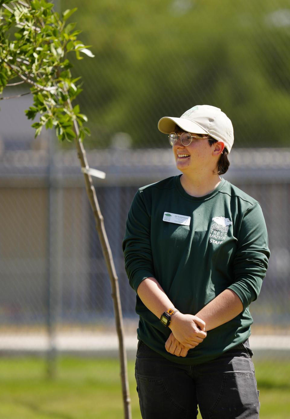 Ali Guttenberg, program manager from Trees Matter, poses at Bethune Elementary School in Phoenix on May 11, 2023, where newly planted trees will add to a canopy of shade cover for the students.