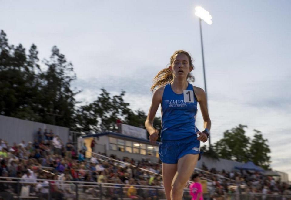 Fiona O’Keeffe of Davis High School puts serious distance between herself and the pack after one lap in the Girls 3200 meter run at the Masters Track and Field meet at Elk Grove High School in 2015.