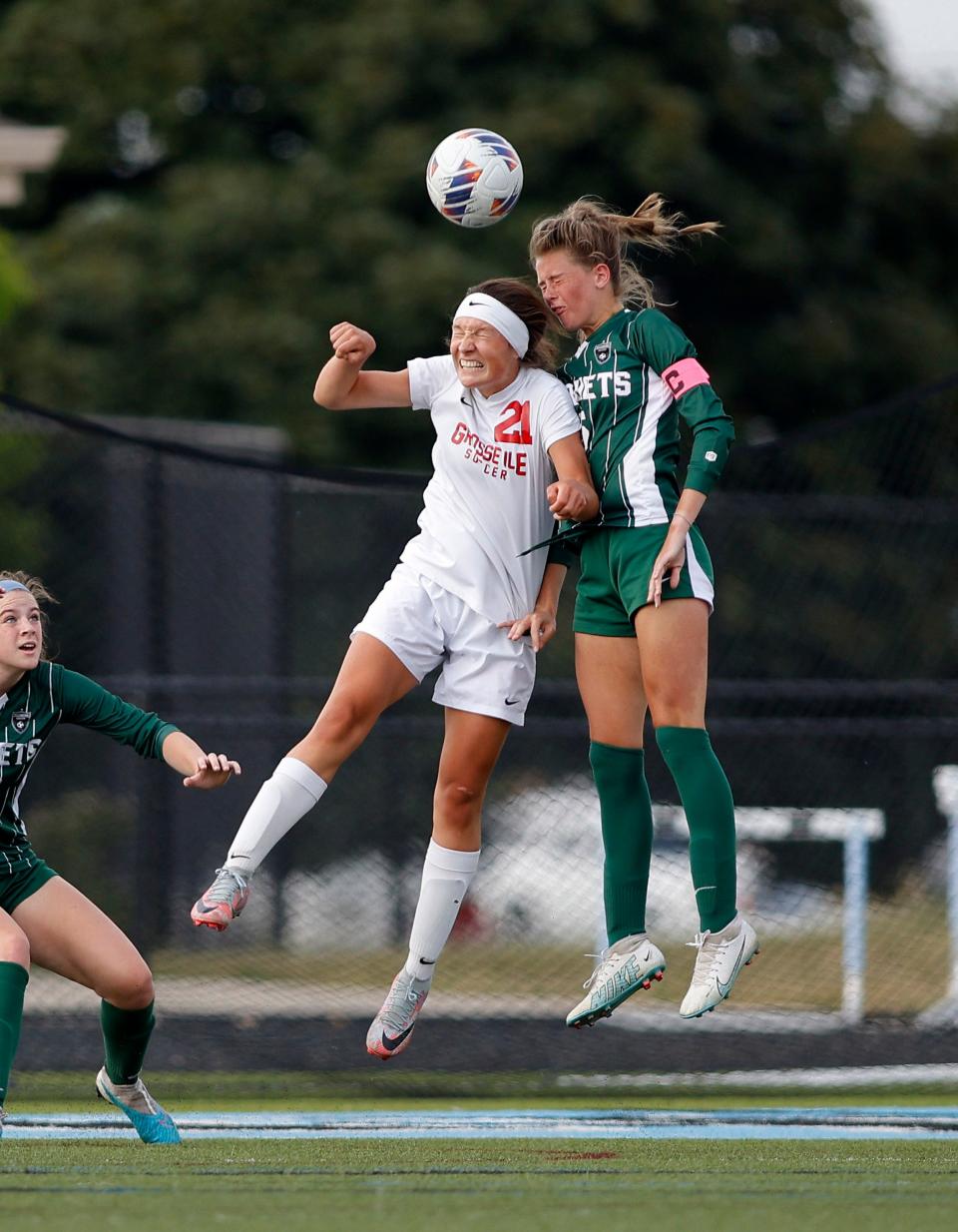 Williamston's Ella Kleiver, right, and Grosse Ile's Natalee Kirk (21) vie for a header, Thursday, June 8, 2023, at Lansing Catholic High School.