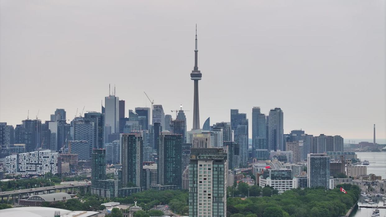 The Toronto skyline is pictured on June 8, 2023. A rainfall warning issued by Environment Canada remains in place for the city due to the possibility of heavy rain stemming from the remnants of Hurricane Beryl. (Patrick Morrell/CBC - image credit)