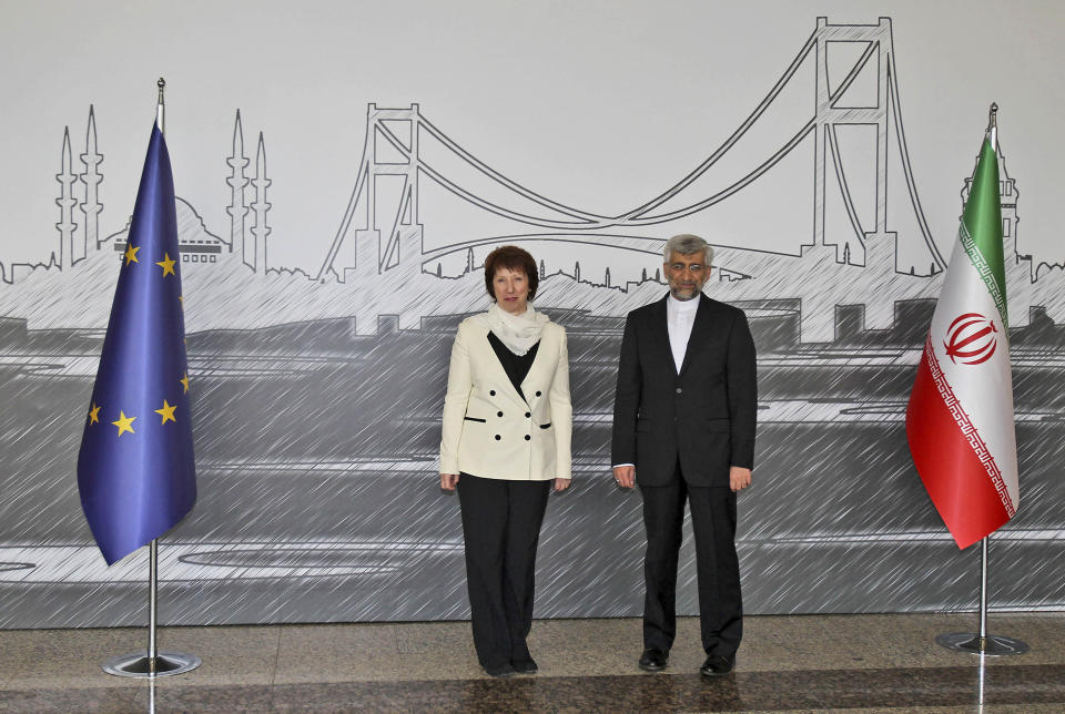 Iran's Chief Nuclear Negotiator Saeed Jalili, right, and EU Foreign Policy Chief Catherine Ashton pose for cameras before their meeting in Istanbul, Turkey, Saturday, April 14, 2012. After years of failure, Iran and the six world powers may finally make some progress on nuclear negotiations when they meet again Saturday if each side shows willingness to offer concessions the other seeks.(AP Photo/Tolga Adanali, Pool)