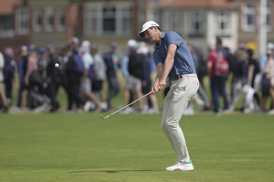 South Africa's Christo Lamprecht (amateur) chips onto the 3rd green during the second day of the British Open Golf Championships at the Royal Liverpool Golf Club in Hoylake, England, Friday, July 21, 2023. (AP Photo/Kin Cheung)