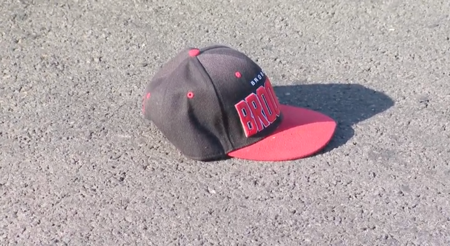 A baseball cap at the scene of a fatal crash in a Van Nuys parking lot. Two people were struck and one of the victims died at the scene after the driver lost control of her vehicle on April 26, 2024. (KTLA)
