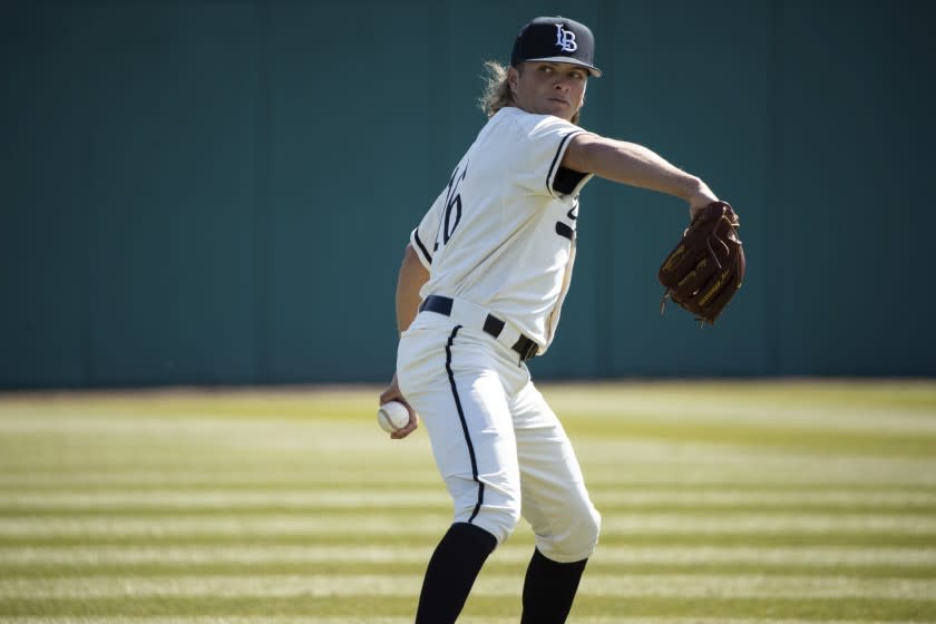 Long Beach pitcher Adam Seminaris (16) warms up prior to a Nevada Wolf Pack at Long Beach State.