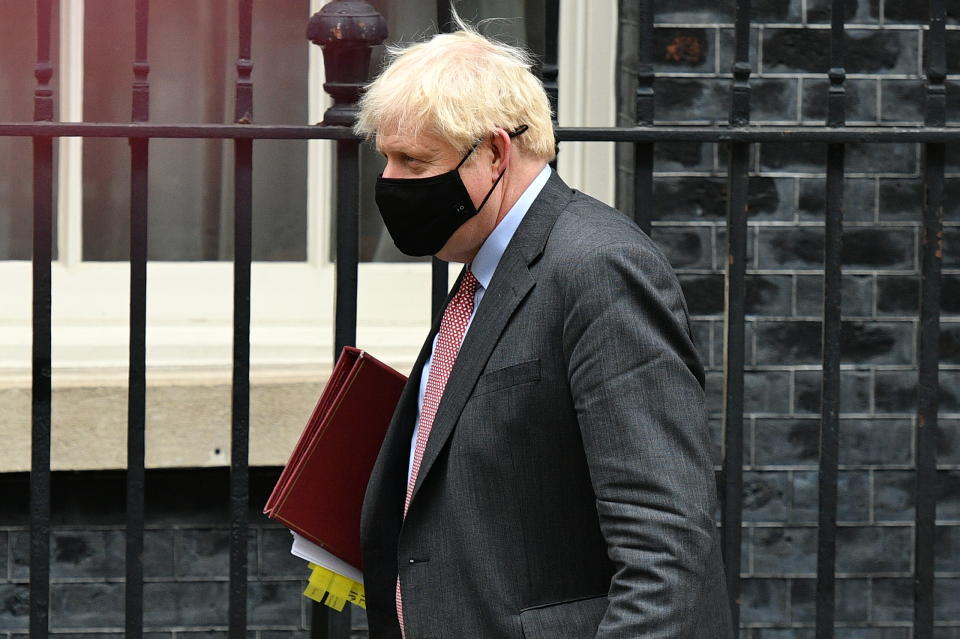 LONDON, ENGLAND - SEPTEMBER 30: Prime Minister, Boris Johnson wearing a face mask leaves Downing Street for PMQs on September 30, 2020 in London, England. The Prime Minister will lead a Covid-19 briefing later  after the UK recorded the highest number of daily coronavirus cases since the begining of the outbreak. (Photo by Leon Neal/Getty Images)