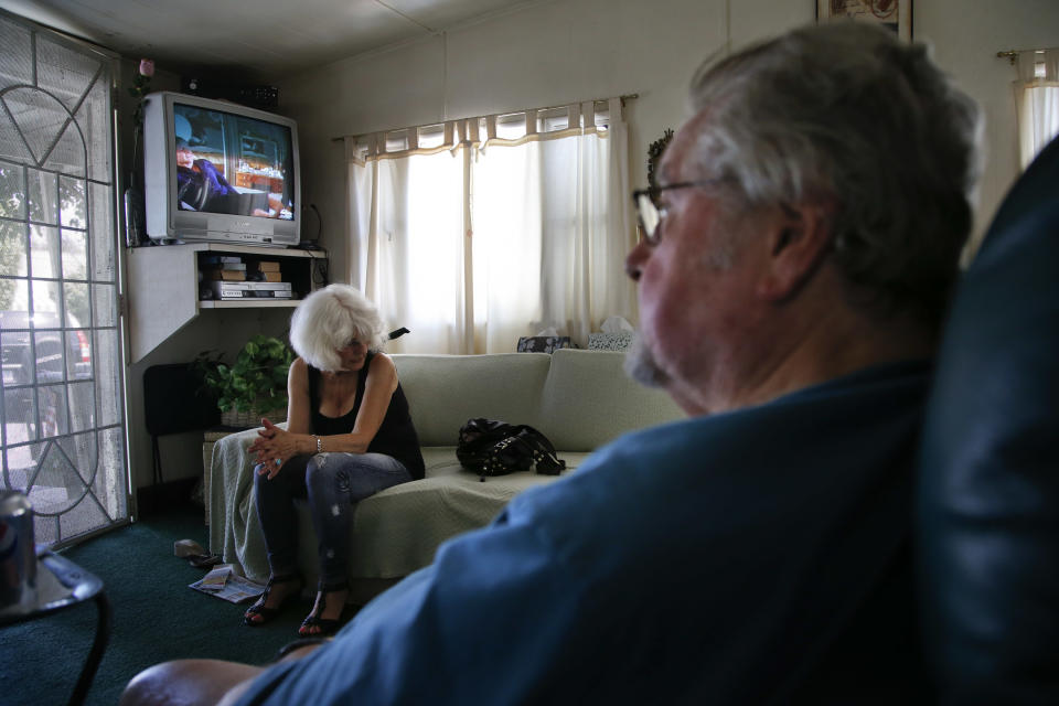 Ray Meeks, right, and his wife, Geri rest in their mobile home at the Santa Monica Village Trailer Park in Santa Monica, Calif., Tuesday, July 10, 2012. The city's Planning Commission recently recommended the 3.8-acre park's zoning be changed to allow a developer to bulldoze its modest, rent-controlled homes and replace them with nearly 200 much-higher-priced apartments and condominiums, as well as more than 100,000 square feet of office and retail space. (AP Photo/Jae C. Hong)