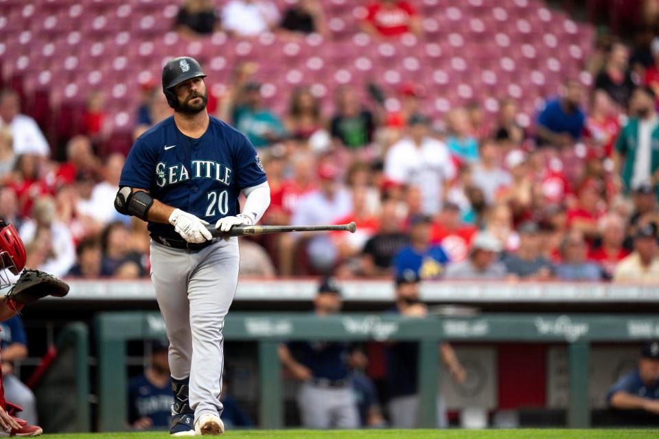 Mike Ford hit 16 home runs for the Seattle Mariners last season, including this one against the Reds at Great American Ball Park last September, but was still designated for assignment.  Ford, who hit two home runs in Thursday's game, is making a strong case to make the Reds' Opening Day roster.