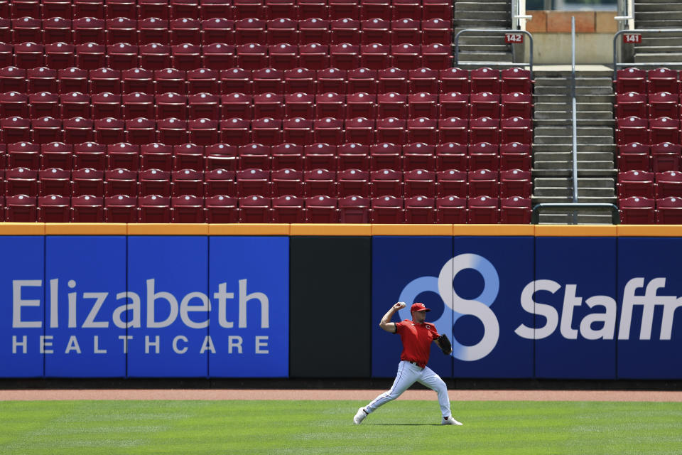 Cincinnati Reds' Sonny Gray (54) throws in the outfield during team baseball practice at Great American Ballpark in Cincinnati, Friday, July 3, 2020. (AP Photo/Aaron Doster)