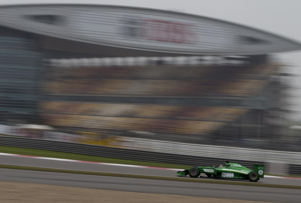 Caterham driver Kamui Kobayashi of Japan drives during his practice session for Sunday's Chinese Formula One Grand Prix at Shanghai International Circuit in Shanghai, China Saturday, April 19, 2014. (AP Photo/Andy Wong)