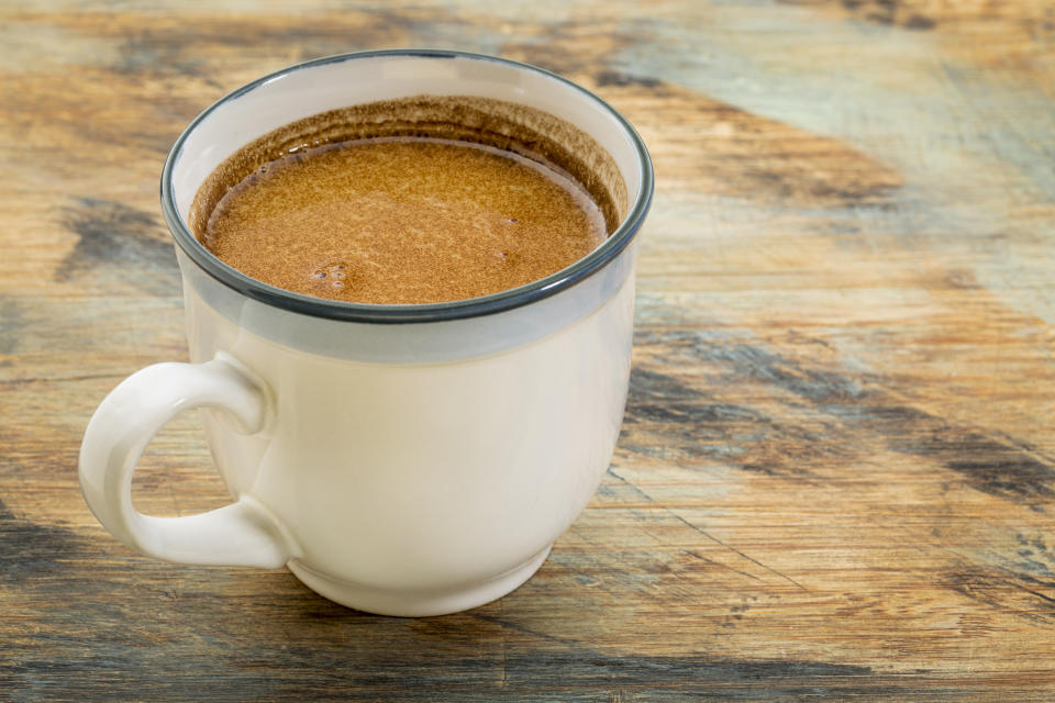 Some people add a dollop of coconut oil to their morning coffee. [Photo : Getty]