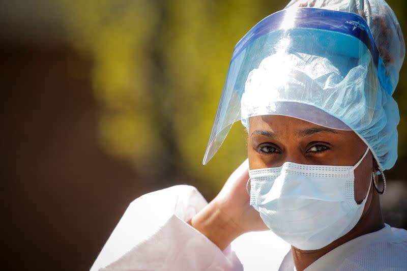 A healthcare worker is seen outside the Brooklyn Hospital Center, during the outbreak of coronavirus disease (COVID-19) in the Brooklyn borough of New York