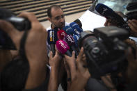 Suleyman Rissouni, uncle of journalist Hajar Rissouni and editor in chief of Akhbar Al-Youm daily newspaper, speaks to the media after the court delivered a one year prison sentence to his niece on accusations of her undergoing an illegal abortion, in Rabat, Morocco, Monday, Sept. 30, 2019. The 28-year old Moroccan journalist Hajar Raissouni was sentenced to one year in prison, Monday, while her fiancé also received a one-year sentence and the doctor accused of terminating the pregnancy was sentenced to two years in jail and suspended from practicing. (AP Photo/Mosa'ab Elshamy)